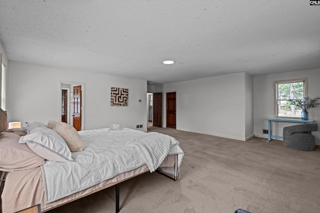 3040 Barnes Springs Rd, Columbia, SC 29204 - bedroom with a textured ceiling, carpet flooring, baseboards, and connected bathroom