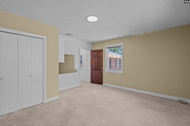 3040 Barnes Springs Rd, Columbia, SC 29204 - unfurnished bedroom featuring carpet flooring, a textured ceiling, baseboards, and a closet