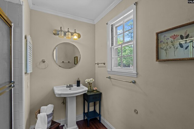3040 Barnes Springs Rd, Columbia, SC 29204 - full bathroom featuring ornamental molding, baseboards, a shower with shower door, wood finished floors, and a sink