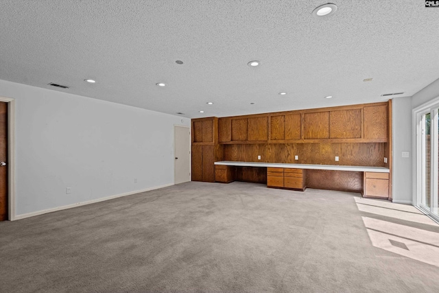 3040 Barnes Springs Rd, Columbia, SC 29204 - unfurnished living room featuring light colored carpet, a textured ceiling, recessed lighting, and baseboards