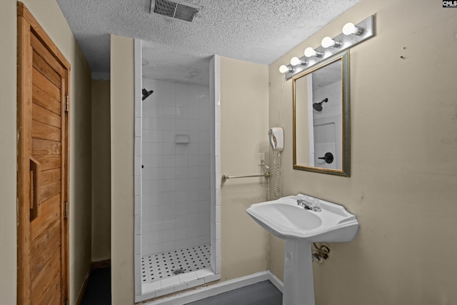 3040 Barnes Springs Rd, Columbia, SC 29204 - full bath featuring a shower stall, a textured ceiling, and baseboards