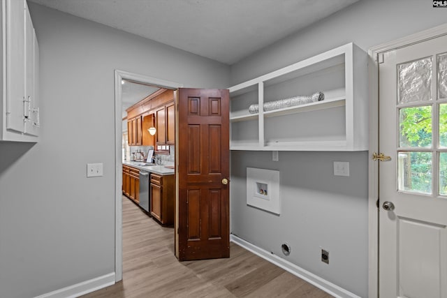 3040 Barnes Springs Rd, Columbia, SC 29204 - clothes washing area with hookup for an electric dryer, cabinet space, light wood-style floors, and baseboards