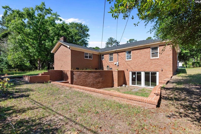 3040 Barnes Springs Rd, Columbia, SC 29204 - rear view of property with a chimney and brick siding