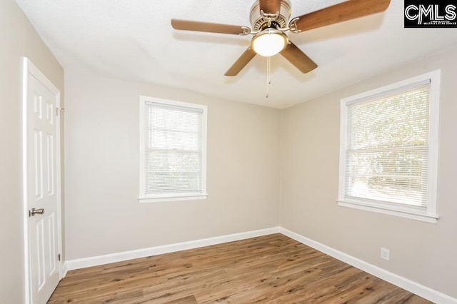 1527 Burnside Ave, Columbia, SC 29209 - spare room featuring healthy amount of natural light, wood finished floors, and baseboards
