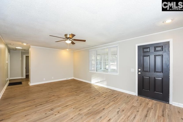 1527 Burnside Ave, Columbia, SC 29209 - entrance foyer featuring a ceiling fan, light wood-style floors, baseboards, crown molding, and a textured ceiling