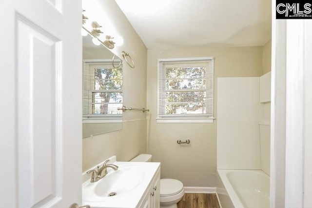 1527 Burnside Ave, Columbia, SC 29209 - bathroom featuring plenty of natural light, toilet, vanity, and wood finished floors