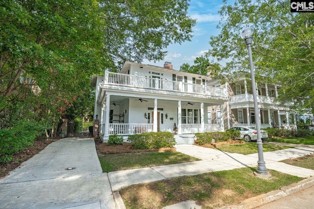 2203 Lincoln St, Columbia, SC 29201 - view of front of property with a ceiling fan, covered porch, and a chimney