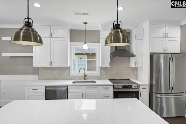 1409 Woodrow St, Columbia, SC 29205 - kitchen featuring stainless steel appliances, a sink, white cabinets, and recessed lighting