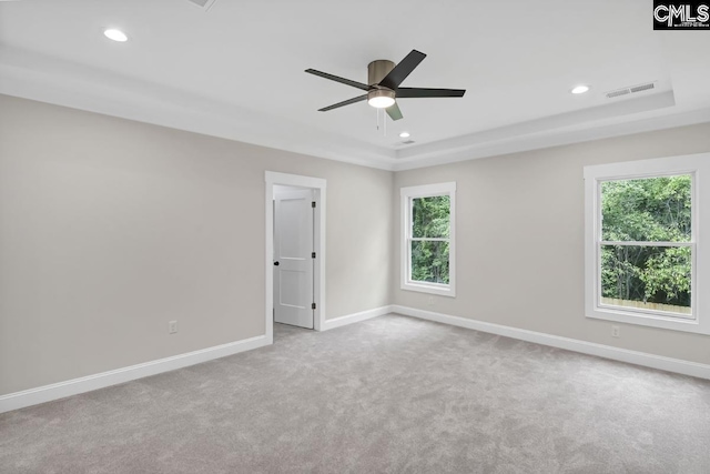 1409 Woodrow St, Columbia, SC 29205 - carpeted spare room with plenty of natural light, baseboards, ceiling fan, a tray ceiling, and recessed lighting