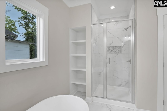 1409 Woodrow St, Columbia, SC 29205 - bathroom with built in shelves, a freestanding bath, a marble finish shower, marble finish floors, and recessed lighting