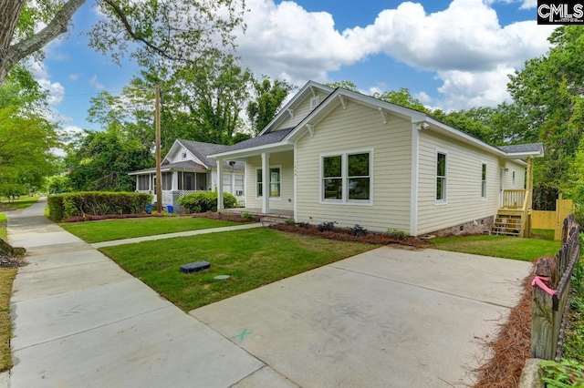 1409 Woodrow St, Columbia, SC 29205 - view of front facade with a front lawn