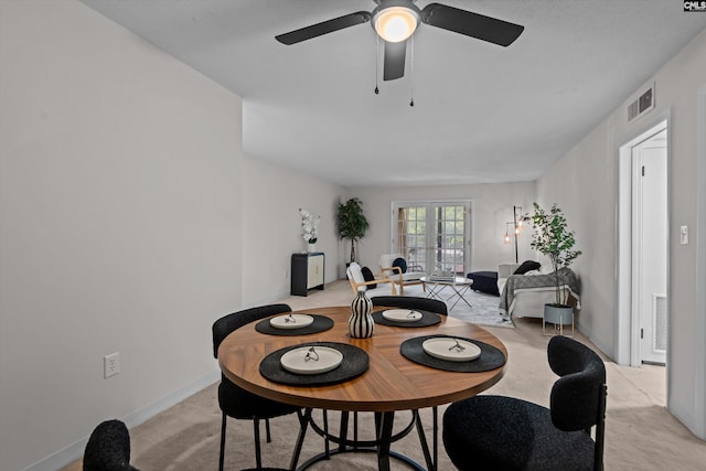 1825 Saint Julian Pl Unit 4E, Columbia, SC 29204 - dining space with light colored carpet, a ceiling fan, and baseboards