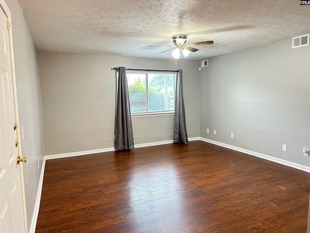 1201 Old Manor Rd, Columbia, SC 29210 - spare room with a ceiling fan, dark wood-type flooring, a textured ceiling, and baseboards