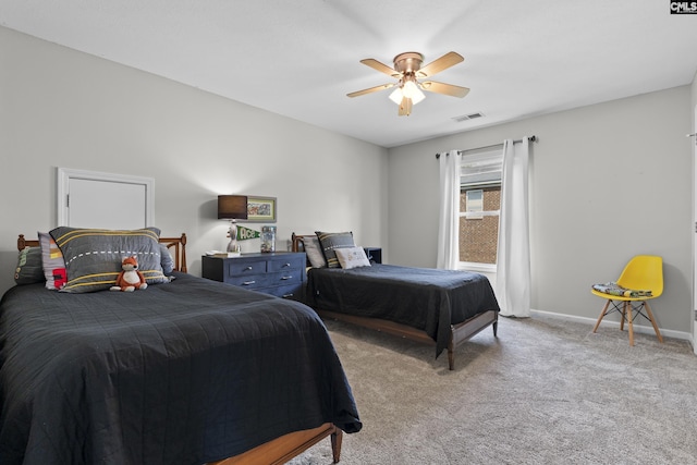 bedroom featuring carpet flooring, baseboards, and a ceiling fan