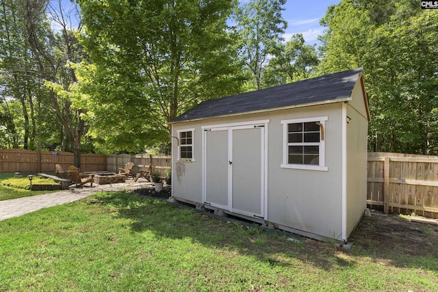 view of shed with a fire pit