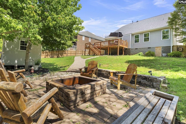 view of patio with an outdoor fire pit, a deck, stairway, and an outbuilding