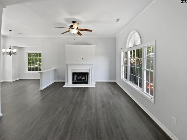 unfurnished living room with baseboards, ceiling fan, dark wood-style flooring, a chandelier, and a fireplace