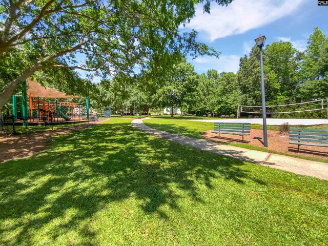 view of home's community featuring volleyball court