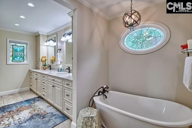 bathroom featuring crown molding, vanity, a soaking tub, baseboards, and tile patterned floors