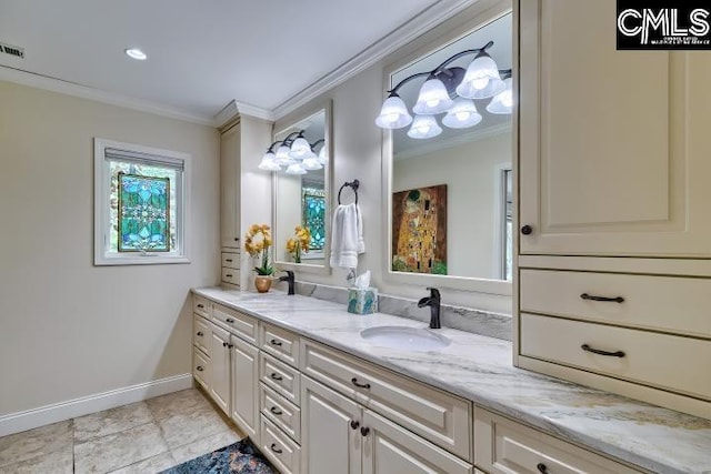 bathroom featuring ornamental molding, vanity, and baseboards