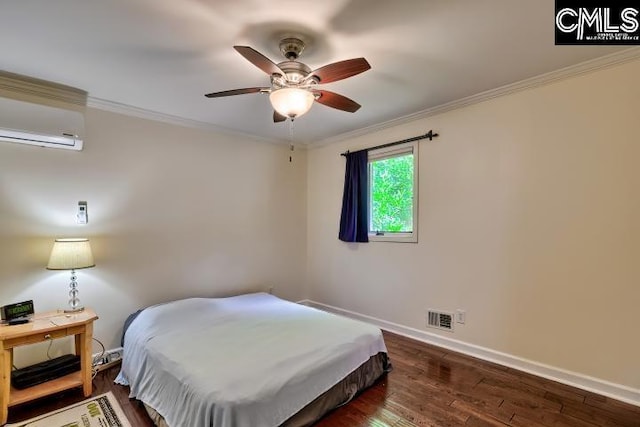 bedroom featuring an AC wall unit, baseboards, dark wood-type flooring, crown molding, and ceiling fan