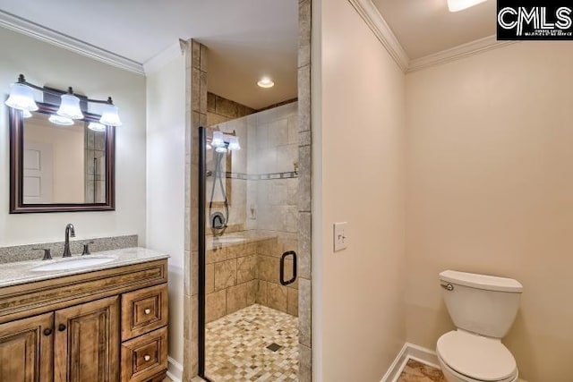 full bath featuring ornamental molding, a shower stall, vanity, toilet, and baseboards