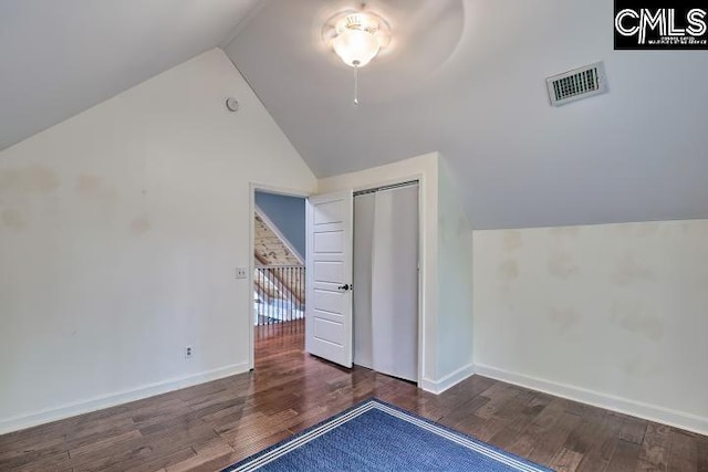 bonus room with lofted ceiling, wood finished floors, and baseboards