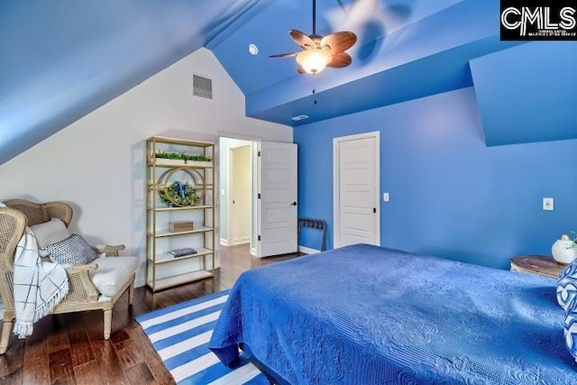 bedroom featuring vaulted ceiling, wood finished floors, and ceiling fan