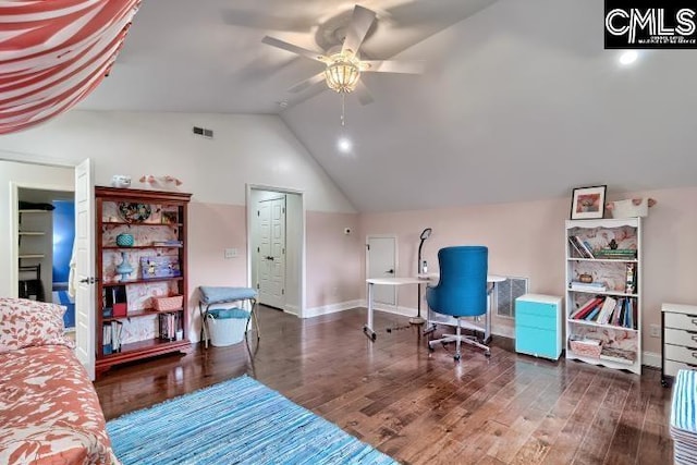 office area with a ceiling fan, vaulted ceiling, wood finished floors, and baseboards