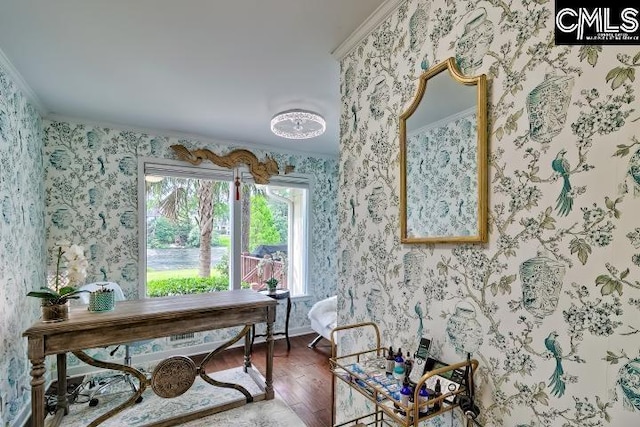 office area with wood finished floors, wallpapered walls, and crown molding