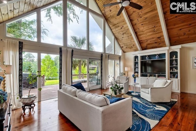 living room with wooden ceiling, high vaulted ceiling, healthy amount of natural light, hardwood / wood-style floors, and beamed ceiling
