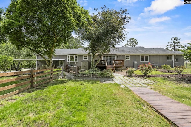 back of property featuring a wooden deck