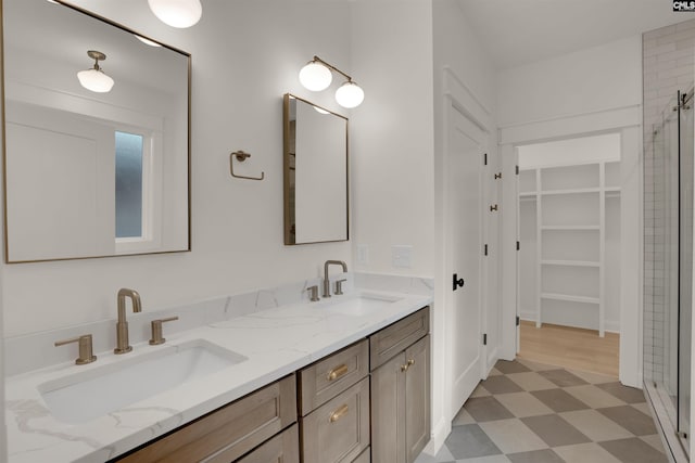 1020 W Confederate Ave, Columbia, SC 29201 - bathroom featuring tile patterned floors, a stall shower, double vanity, and a walk in closet