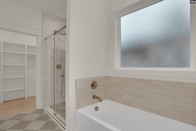1020 W Confederate Ave, Columbia, SC 29201 - bathroom featuring a stall shower, a spacious closet, and a garden tub