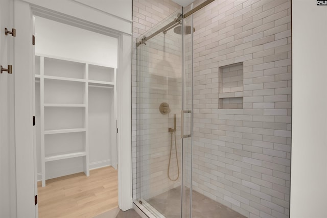 1020 W Confederate Ave, Columbia, SC 29201 - full bathroom featuring a shower stall, wood finished floors, and a walk in closet