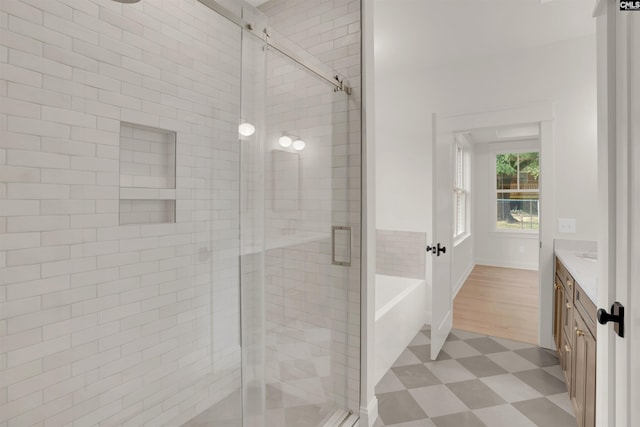 1020 W Confederate Ave, Columbia, SC 29201 - bathroom with tile patterned floors, a stall shower, vanity, and a tub to relax in