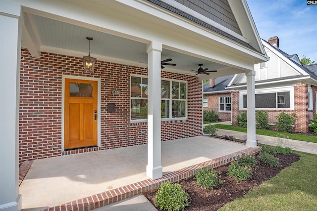 1020 W Confederate Ave, Columbia, SC 29201 - property entrance featuring brick siding, covered porch, ceiling fan, and a chimney