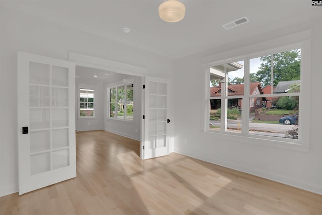 1020 W Confederate Ave, Columbia, SC 29201 - unfurnished room featuring french doors, light wood finished floors, crown molding, and baseboards