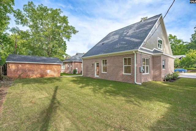 1020 W Confederate Ave, Columbia, SC 29201 - rear view of house featuring brick siding, a yard, and a shingled roof