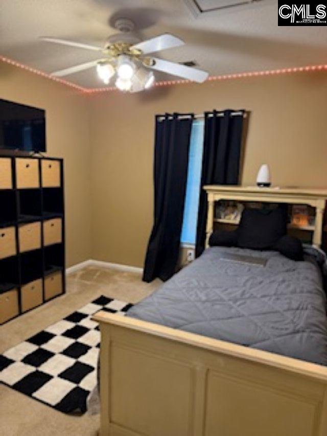 bedroom featuring baseboards
