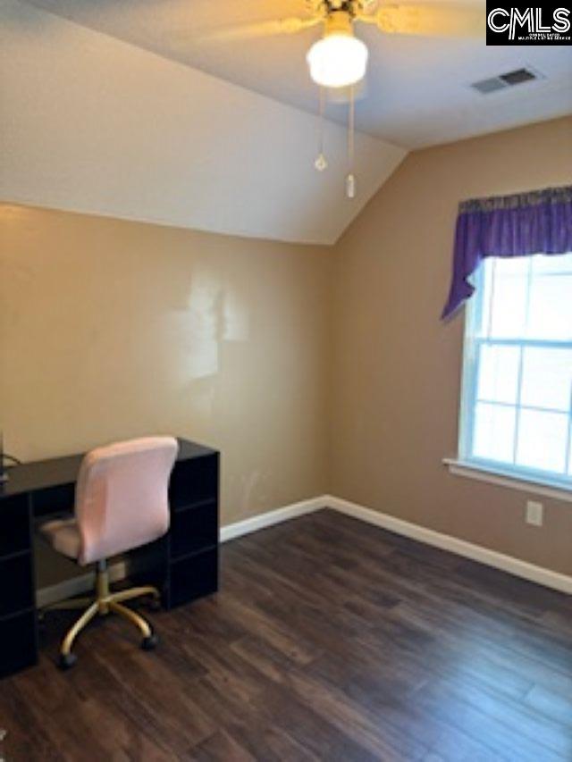 office space with lofted ceiling, wood finished floors, baseboards, and a ceiling fan