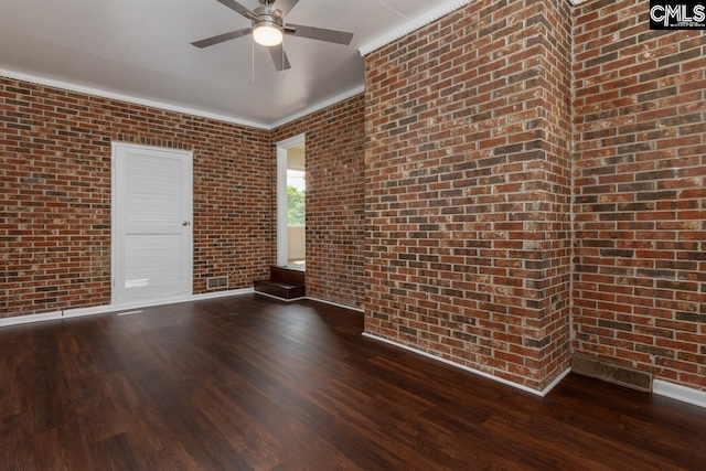 3901 Overdale Dr, Columbia, SC 29223 - unfurnished room with dark wood finished floors, brick wall, ceiling fan, and baseboards