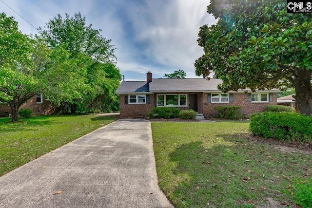3901 Overdale Dr, Columbia, SC 29223 - ranch-style house featuring brick siding, concrete driveway, a front lawn, and a chimney