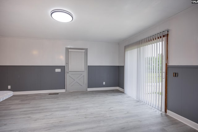 969 Boulevard Rd, Sumter, SC 29153 - unfurnished room featuring wainscoting, wood finished floors, and crown molding