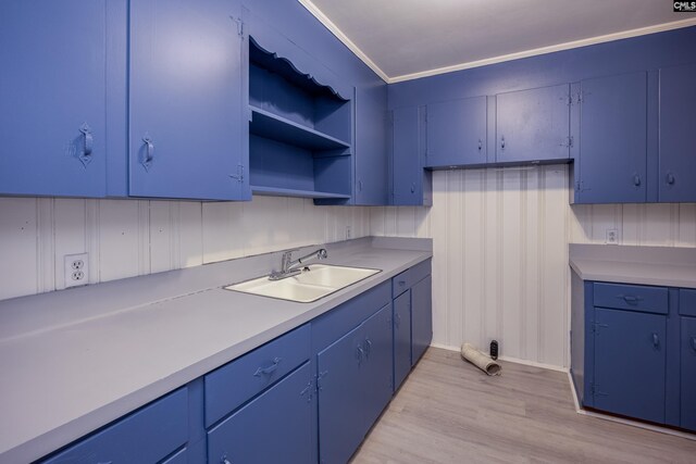 969 Boulevard Rd, Sumter, SC 29153 - kitchen featuring a sink, blue cabinetry, light wood finished floors, light countertops, and open shelves