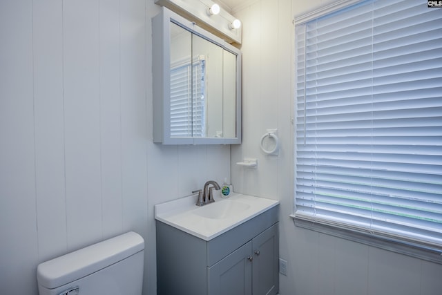 969 Boulevard Rd, Sumter, SC 29153 - half bathroom featuring vanity, toilet, and a decorative wall