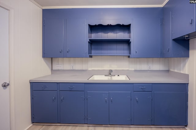 969 Boulevard Rd, Sumter, SC 29153 - kitchen featuring a sink, open shelves, blue cabinets, and light countertops