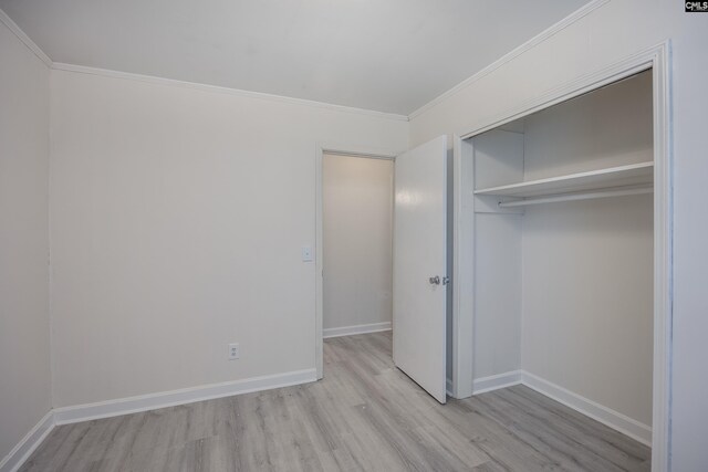 969 Boulevard Rd, Sumter, SC 29153 - unfurnished bedroom with light wood-type flooring, a closet, baseboards, and ornamental molding