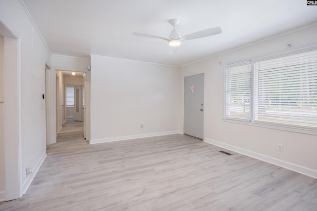 969 Boulevard Rd, Sumter, SC 29153 - empty room featuring crown molding, light wood finished floors, a ceiling fan, and baseboards