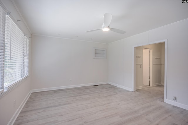 969 Boulevard Rd, Sumter, SC 29153 - unfurnished bedroom featuring multiple windows, crown molding, light wood finished floors, and baseboards